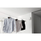 Retractable clothesline holding shirts indoors