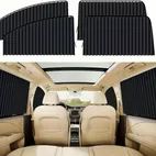 Black car window shades fitted to rear side windows of a beige car interior