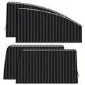 Two black pleated car window shade panels on a white background