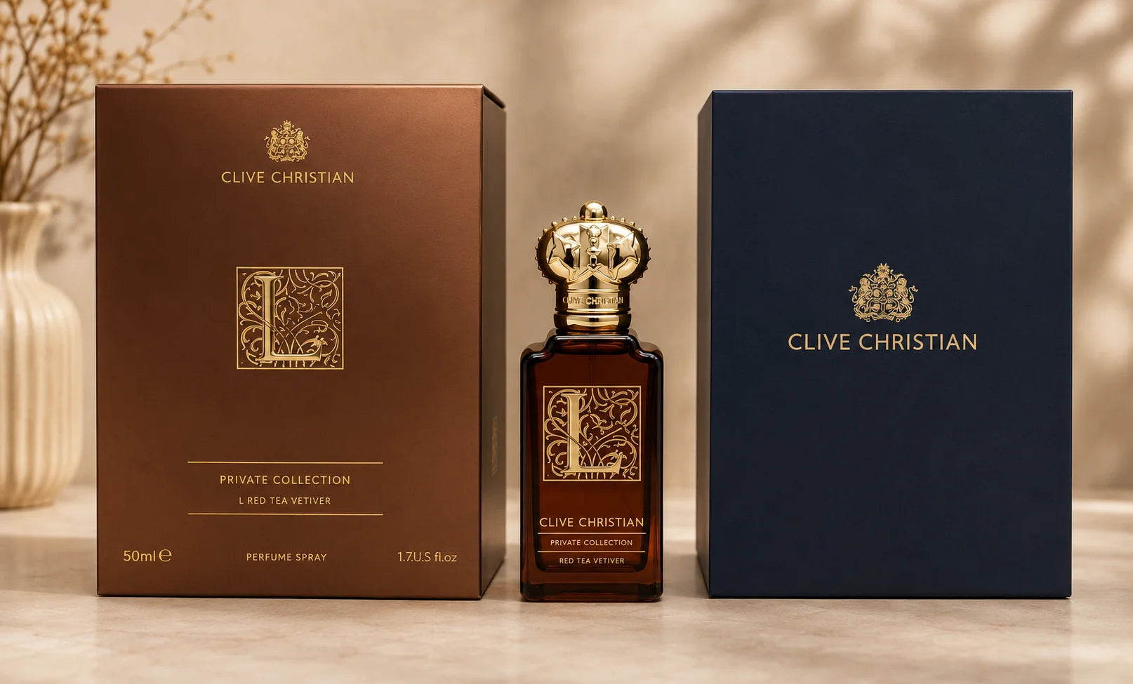 Clive Christian Private Collection L Red Tea Vetiver perfume bottle displayed between its dark brown and navy blue branded boxes on a light marble surface.