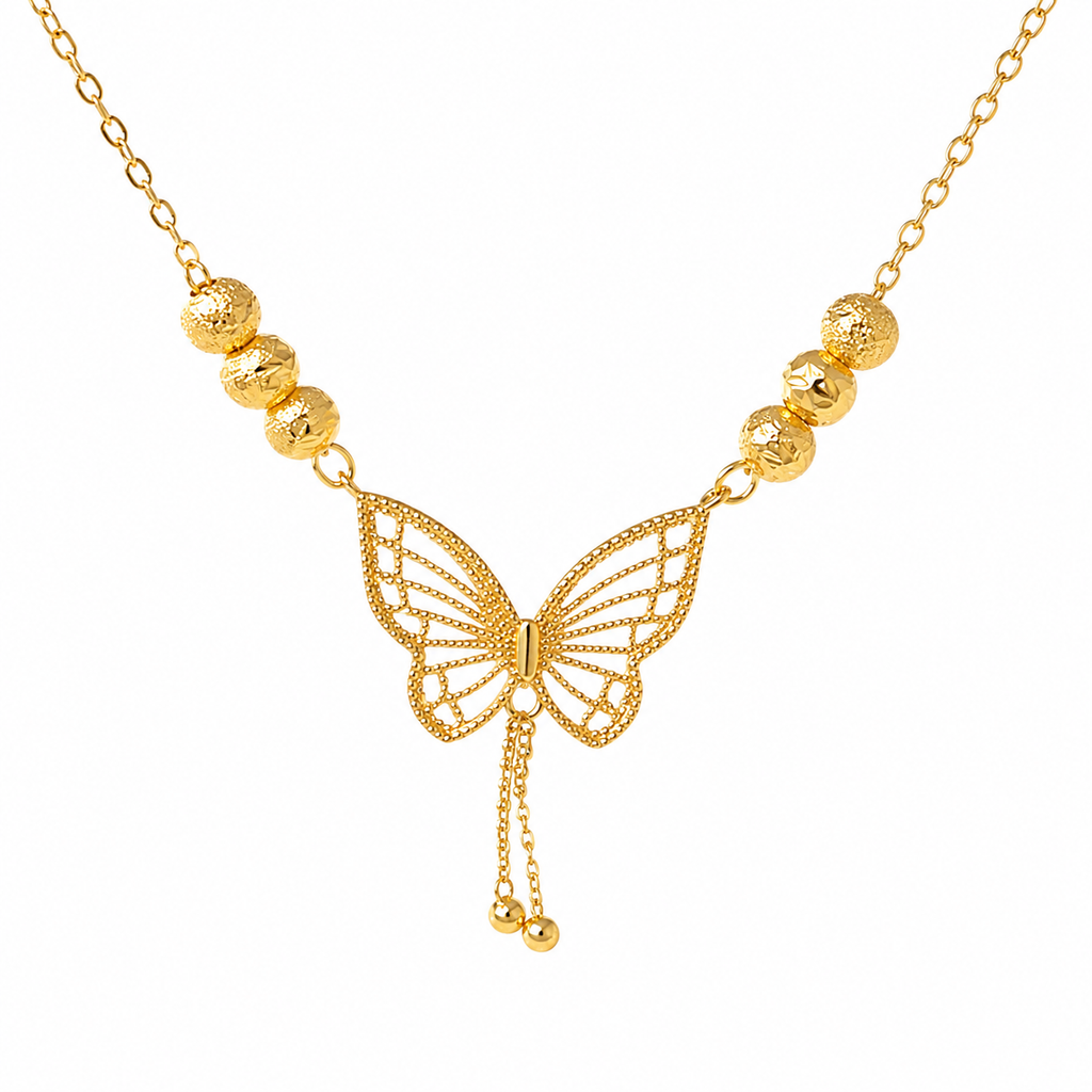 A gold butterfly necklace with a delicate chain, textured gold beads on each side, and a central butterfly pendant with dangling chain ends, shown on a plain white background.