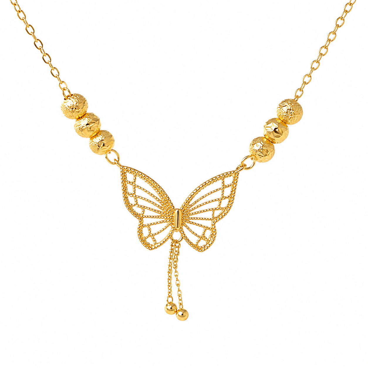A gold butterfly necklace with a delicate chain, textured gold beads on each side, and a central butterfly pendant with dangling chain ends, shown on a plain white background.