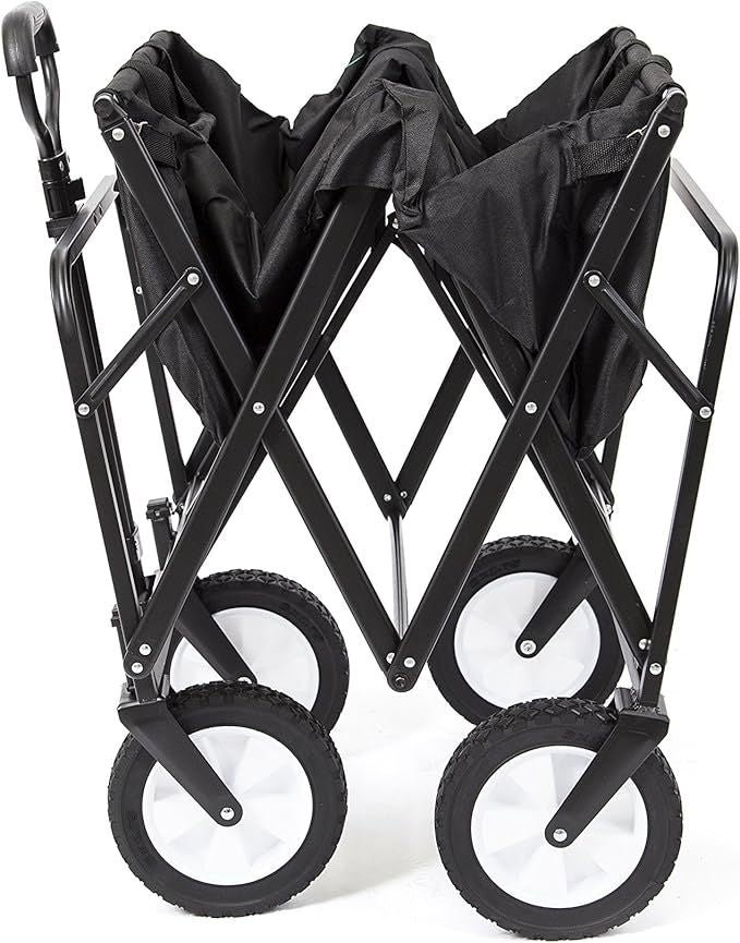 Black utility wagon folded flat into its collapsed frame, showing wheels, on a white background