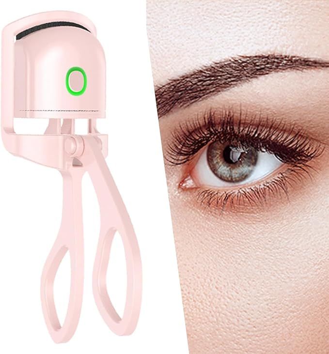 Pink heated eyelash curler with close-up of an eye with curled natural lashes on a white background