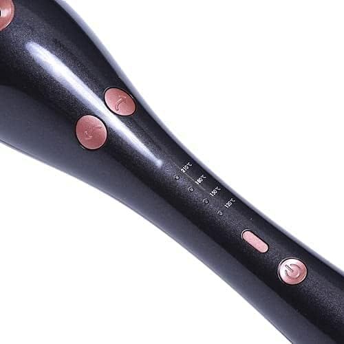 Close-up of the hair curler's control buttons and temperature markings on a white background