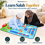 Parent and child learning Salah together on smart prayer mat