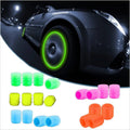 Neon glow tire tube covers in multiple colors including green, yellow, pink, blue, and orange, shown both individually and applied to a car wheel in a dark outdoor setting.